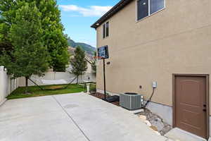 View of patio / terrace featuring a mountain view and cooling unit