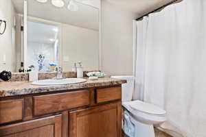 Bathroom with vanity and toilet