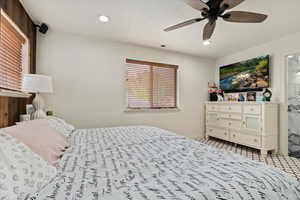 Bedroom with carpet and ceiling fan