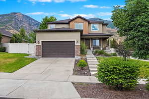 View of front of house featuring a porch and a mountain view