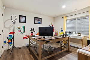 Home office featuring wood-type flooring