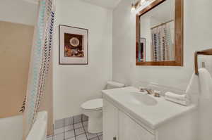 Bathroom with large bathtub & shower. Large storage closet.