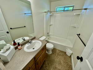 Full bathroom featuring tile flooring, vanity, toilet, and shower / bathtub combination