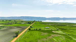 Aerial view with a rural view and a water and mountain view