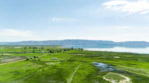 Aerial view featuring a rural view and a water and mountain view