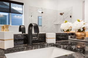 Bathroom with sink and an enclosed shower