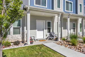 View of exterior entry with a porch