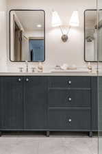 Bathroom with tile floors and double vanity