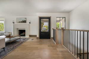 Foyer with light hardwood / wood-style floors