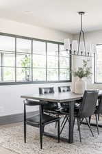 Dining area featuring a wealth of natural light and hardwood / wood-style flooring