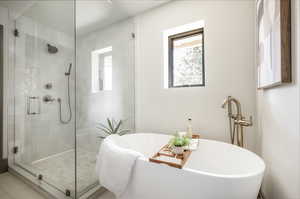 Bathroom featuring tile flooring and independent shower and bath