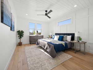 Master Bedroom on main floor featuring ceiling fan, light wood-type flooring, wooden ceiling, and multiple windows