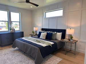 Master Bedroom with ceiling fan and light wood-type flooring