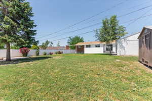 View of yard featuring an outdoor structure