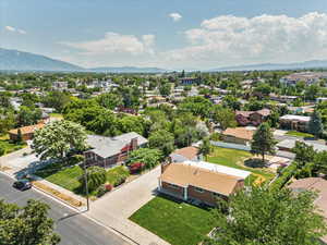 Birds eye view of property with a mountain view