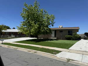 View of front of property with a front yard