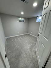 Basement with carpet