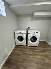 Laundry room featuring hookup for a washing machine, washing machine and clothes dryer, and dark wood-type flooring