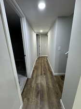 Hallway featuring dark hardwood / wood-style floors