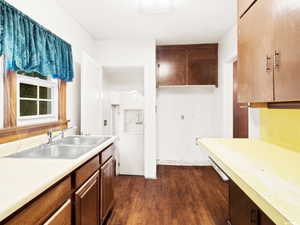 Kitchen with sink and dark hardwood / wood-style floors