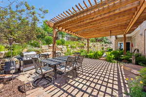 View of patio / terrace featuring a pergola and a grill