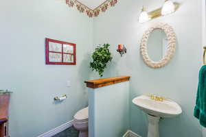 Bathroom with tile flooring and toilet