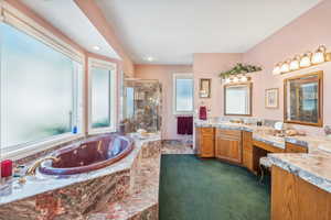 Bathroom with vanity and plus walk in shower