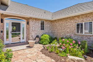 Entrance to property with a patio