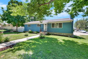 Single story home featuring a front yard