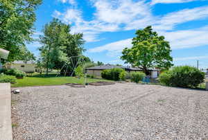 View of yard featuring a playground and large RV parking