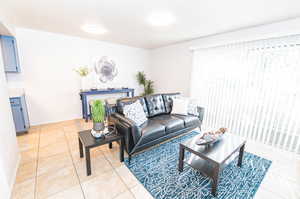 Living room featuring tile flooring