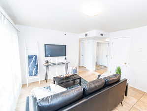 Living room with light tile floors