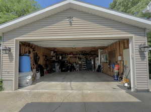 Oversized 2 car garage 25 ft x 21.5 ft with built in shelving and overhead storage