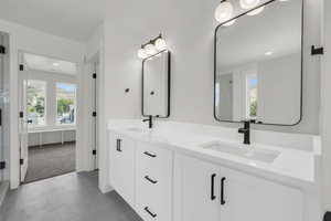 Bathroom with tile patterned flooring and vanity