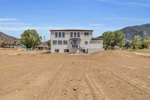 Rear view of house featuring a mountain view