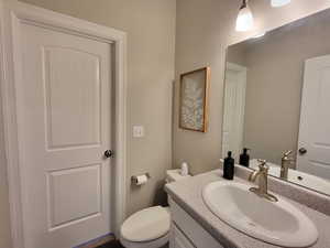 Bathroom with toilet and large vanity