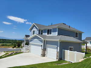 View of front of home featuring a garage