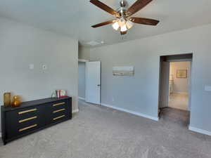 Carpeted bedroom with ceiling fan