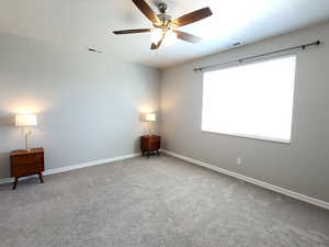 Unfurnished room with carpet floors and ceiling fan