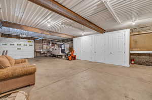 Lower Garage. Built in closets, workbench, shelving, and snowblower included.