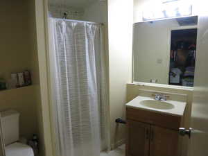 Bathroom featuring vanity and toilet