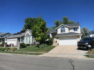 View of front of property featuring a garage