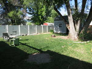 View of yard with a shed