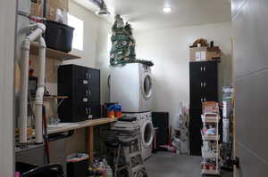 Interior space featuring stacked washing maching and dryer