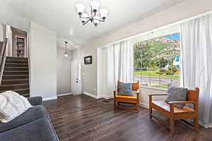 Interior space featuring dark hardwood / wood-style flooring and a chandelier