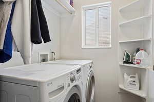 Laundry room featuring washer and dryer and washer hookup