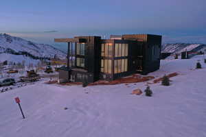 Snow covered property featuring a mountain view