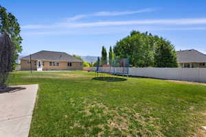 View of yard featuring a trampoline