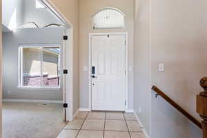 Entryway with light tile floors