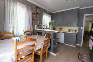 Tiled dining area with ornamental molding